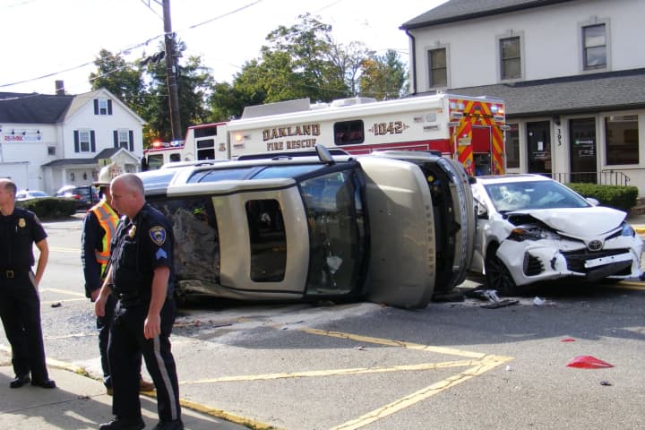 Oakland Multi-Vehicle Crash: Land Rover Upended, Police Car Struck