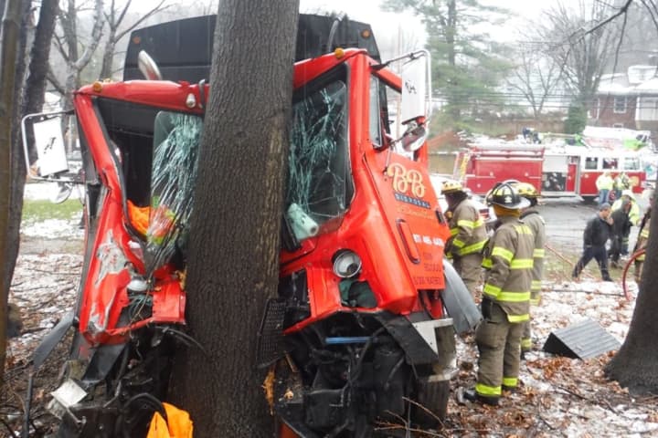 PHOTOS: Garbage Truck Slams Into Tree, Hawthorne Officer Rescues Driver