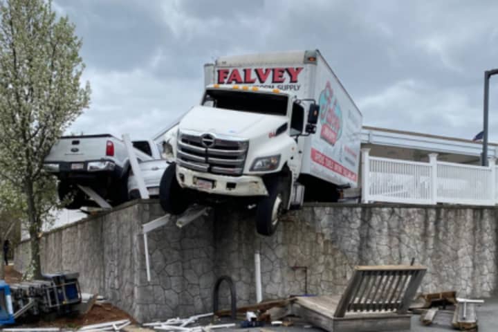 Box Truck Dangles Over Wall After Crashing Into Norfolk Gas Station: Police