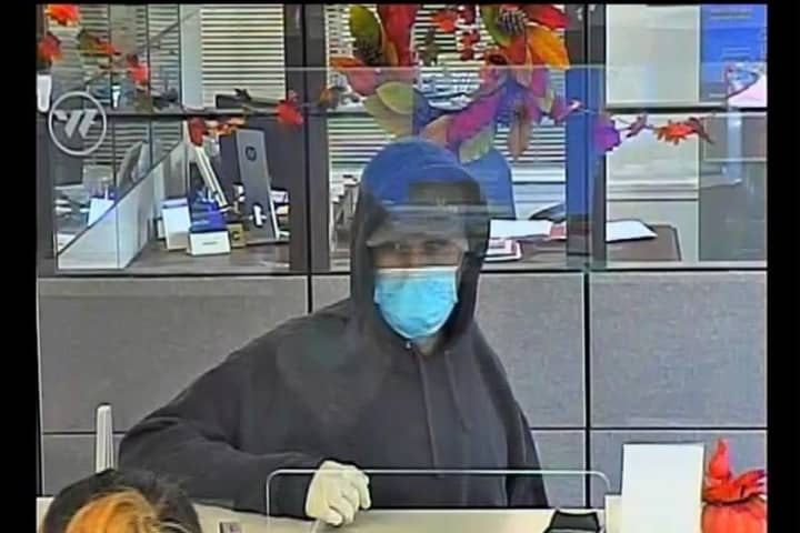 Police Search For Suspect In Bank Robbery In Region