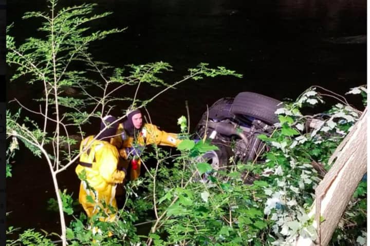 SUV Lands In Saugatuck River After Crashing Off Road