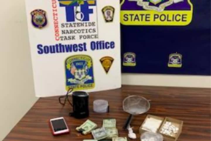 Firearm, Drugs, Cash Confiscated In Bust