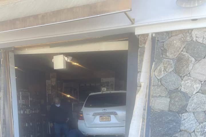 Car Plows Into Store In Area