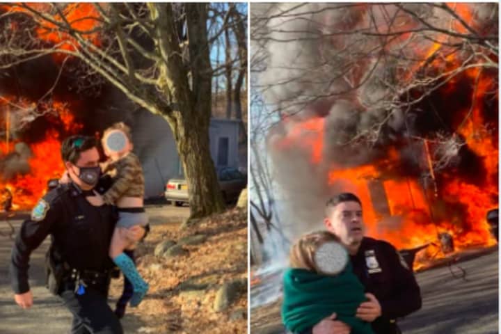 Officers Race In To Help Rescue Two Children After House Fire Breaks Out In Area