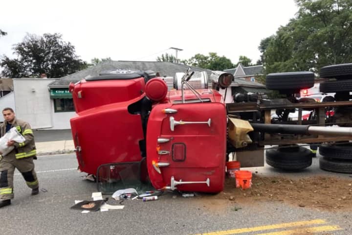 Overturned Dump Truck Spills Across Avenue