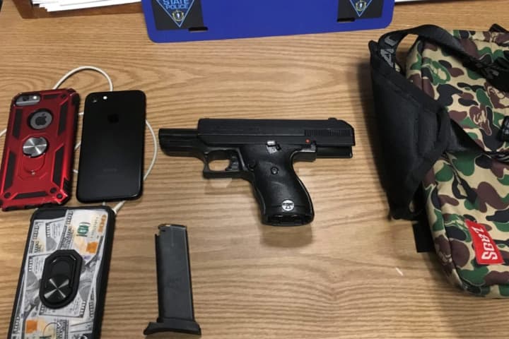 Guns, Cell Phones Seized; Revoked Registration Leads To Arrest