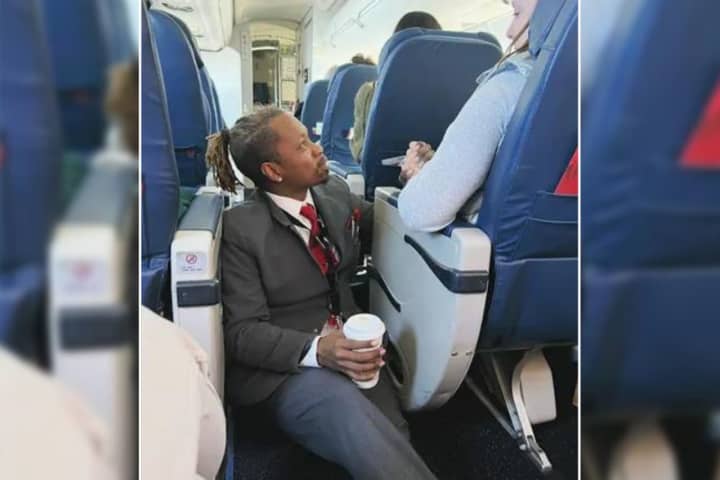 Viral Photo Shows 'Gem' Flight Attendant Comforting Nervous Flier On Trip To JFK