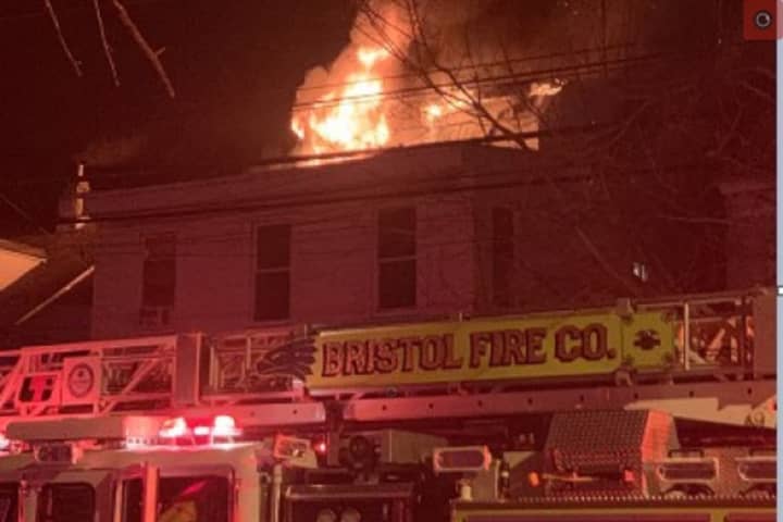 Three-Story Fire Ravages Residential Building