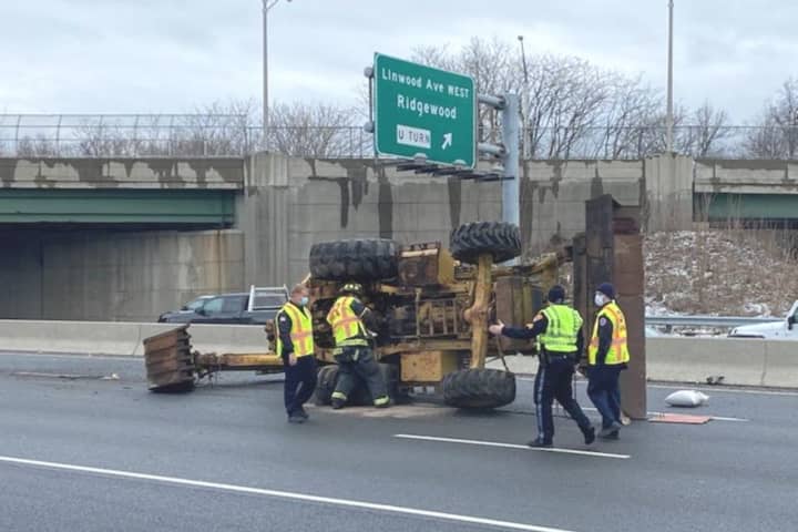 Backhoe Hits Overpass, Topples Onto Route 17