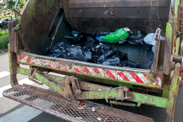 DEADLY GARAGE: PA Trash Collector Crushed By Own Truck