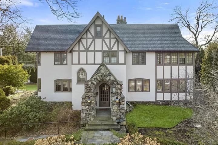 $3.25M Tudor-Style House In Newton Features Two-Tiered Deck With Built-In Gas Grill