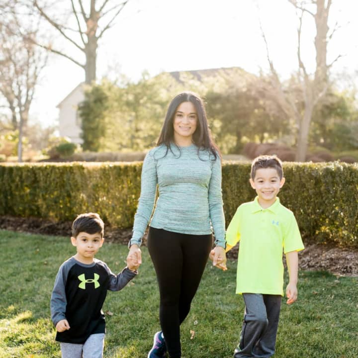 Madelin LoBue of Cresskill with boys Charlie, 5, and Joseph, 7. LoBue is the coordinator of Healthy Kids Running Series, which is wrapping up its second season in Cresskill.