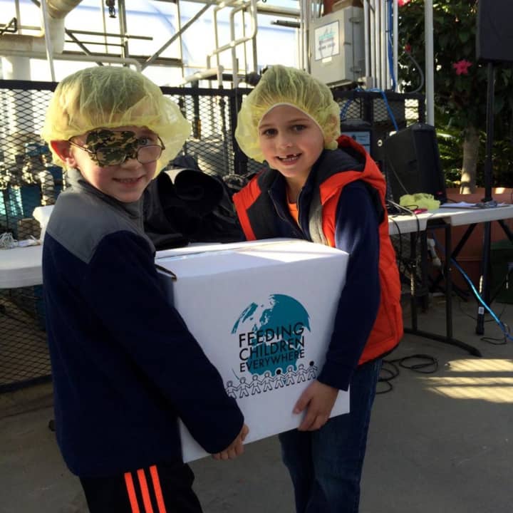 Youngsters help package food at last year&#x27;s Hunger Project at Mahwah&#x27;s Secor Farms.