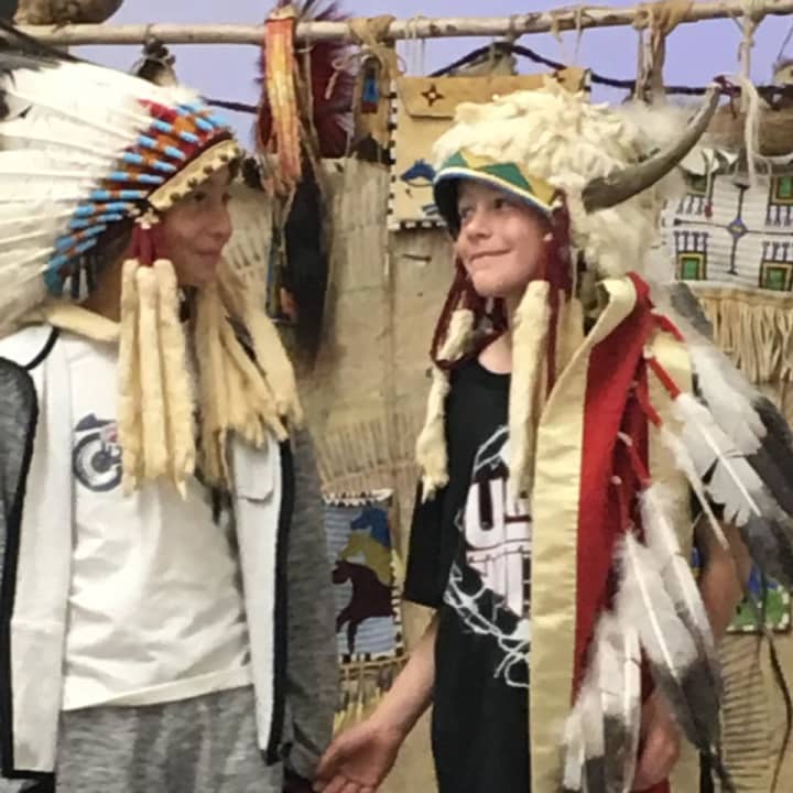 Students donned traditional headdresses after learning about Native American life during a recent presentation at the Fulmer Road Elementary School in Mahopac.
