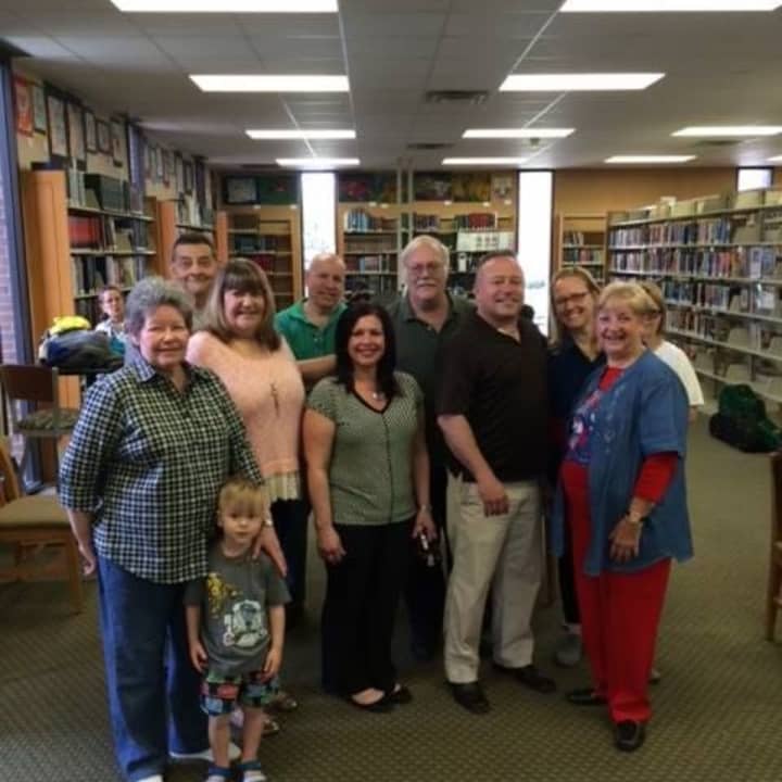 Elected officials library trustees (and their grandchildren!) cheer the 75th anniversary.