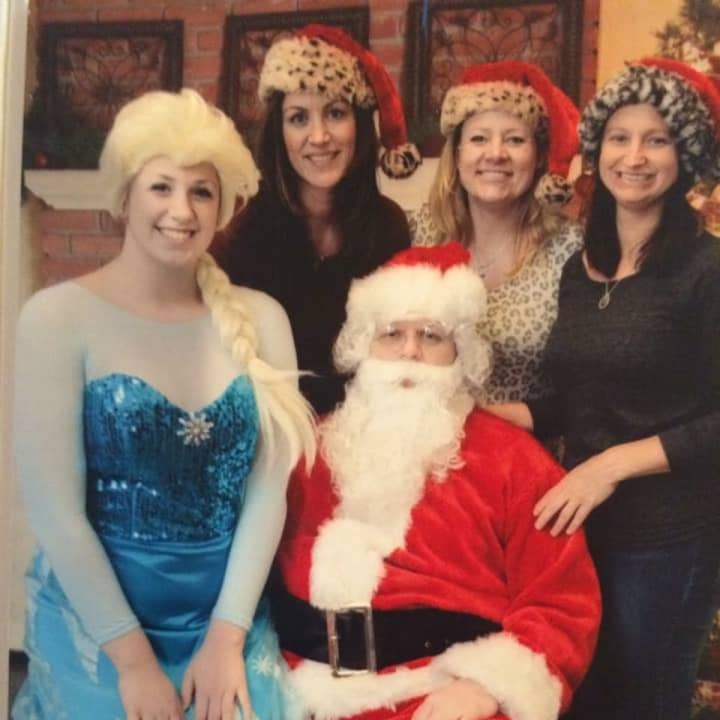 The &quot;Bad Girls&quot; with Santa (Chuck Kohout), from left,  Derek Danbe, Brian Danbe, and Jocelyn Danbe.