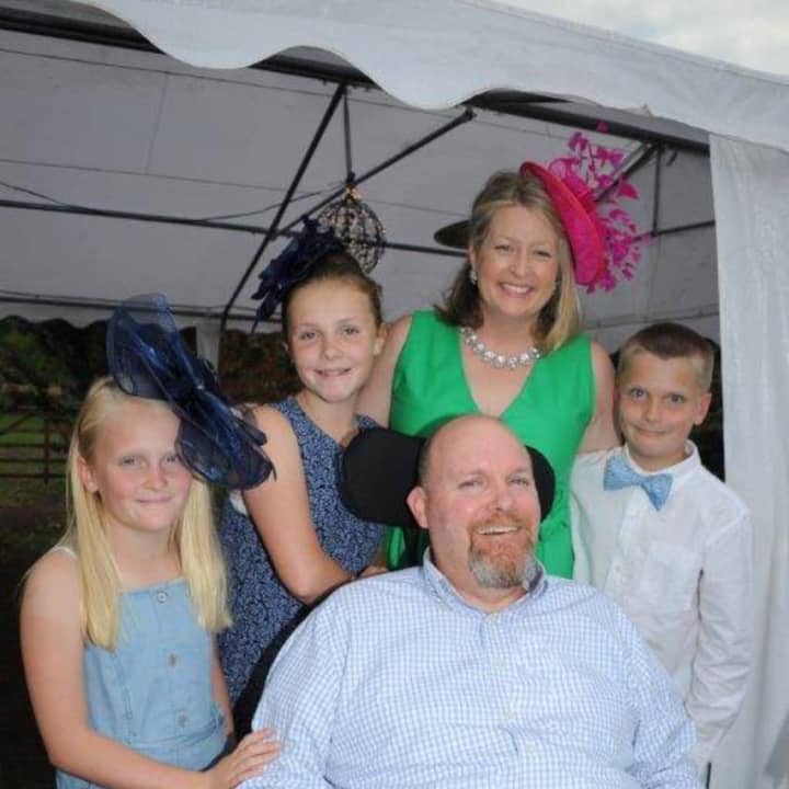 Brad Frith with his wife and children.
