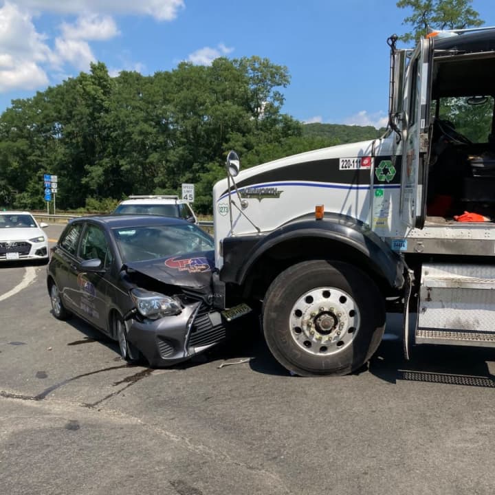 A driver was hospitalized after being struck by a truck in Hillburn.