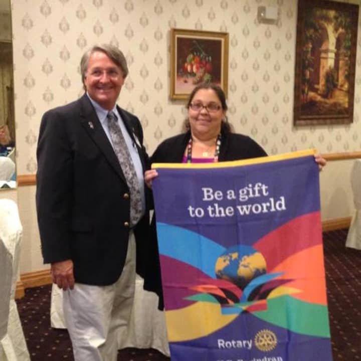 Garfield Rotary Club President Angela Mattina, at right, with Rotary District Gov. Peter Wells.