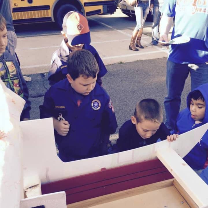 Saddle Brook Cub Scouts work on pinewood derby vehicles.