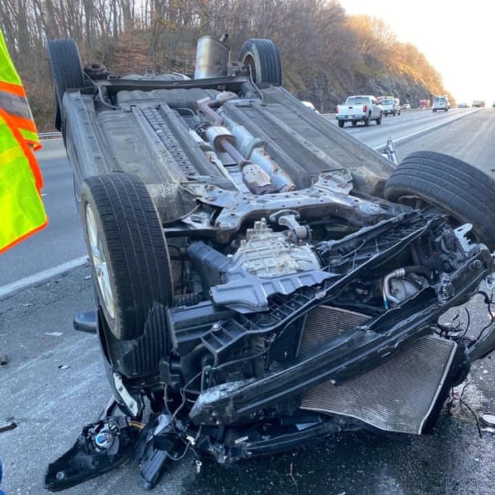 A Hyundai flipped over after crashing into a dump truck on Route 78 in Hunterdon County Monday morning, state police said.
