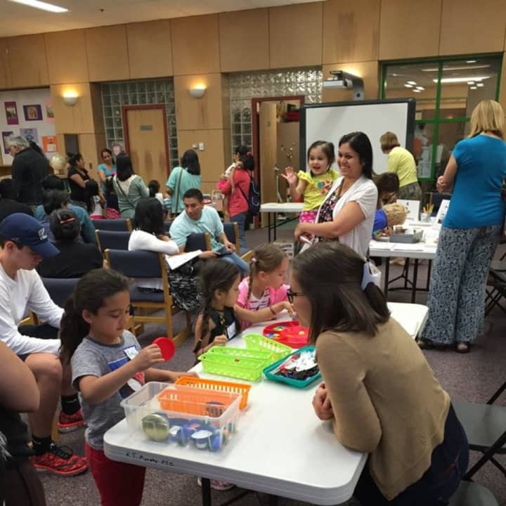 Parents and children attend a recent Play to Learn event.