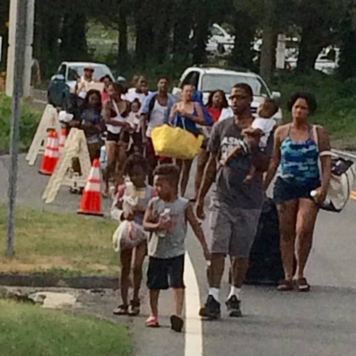 Beachgoers are allowed to walk in to Squantz Pond State Park in New Fairfield even after the parking lot is filled, as was the case on Sunday.
