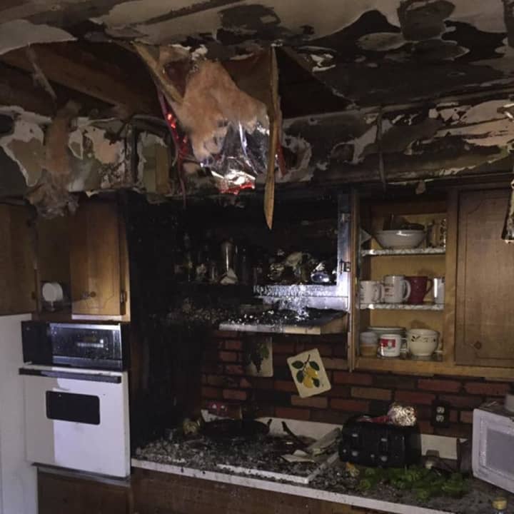 Fire severely damaged a Hillside Lane kitchen on Monday, spreading smoke across the rest of the house.