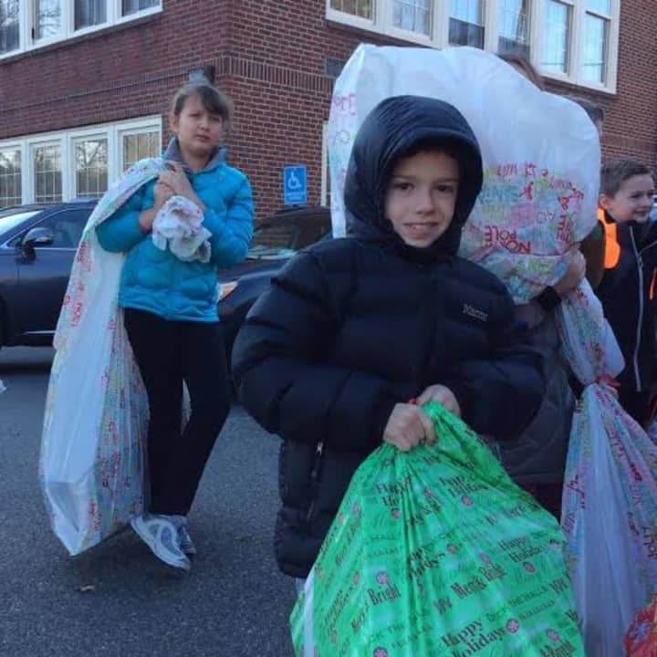 Scarsdale fifth-graders helped deliver toys to kids in the Bronx on Wednesday.