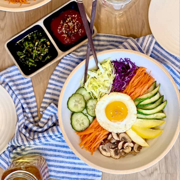 Bibimbap (&quot;A traditional Korean rice recipe with seasonal vegetables in a mixed bowl and special dressing.&quot;)