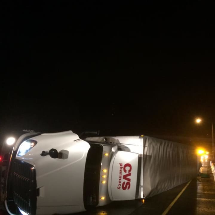 A rolled-over tractor-trailer is closing part of westbound I-84 in Danbury early Wednesday.