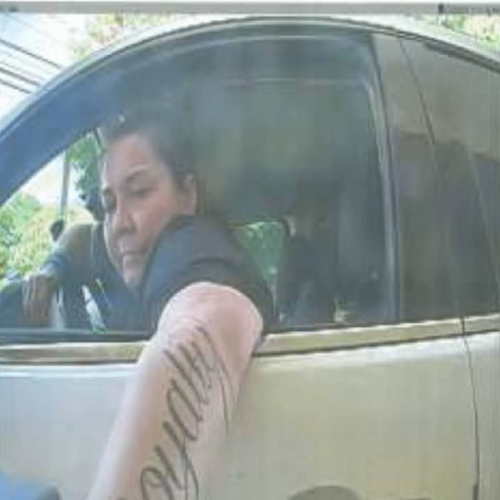 This is a suspect in counterfeit check-cashing incidents in the Fairfield County area in July and August. She has a tattoo reading &#x27;loyalty&#x27; in script on her left arm.