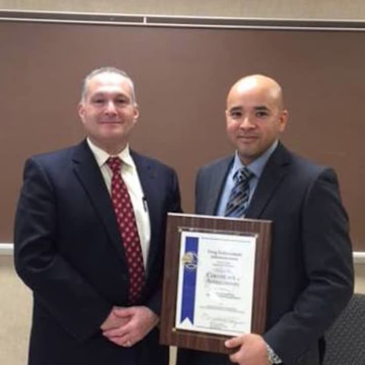 Trumbull Police Detective Edgar Perez is honored Wednesday by the Drug Enforcement Administration for work with the Bridgeport DEA office.