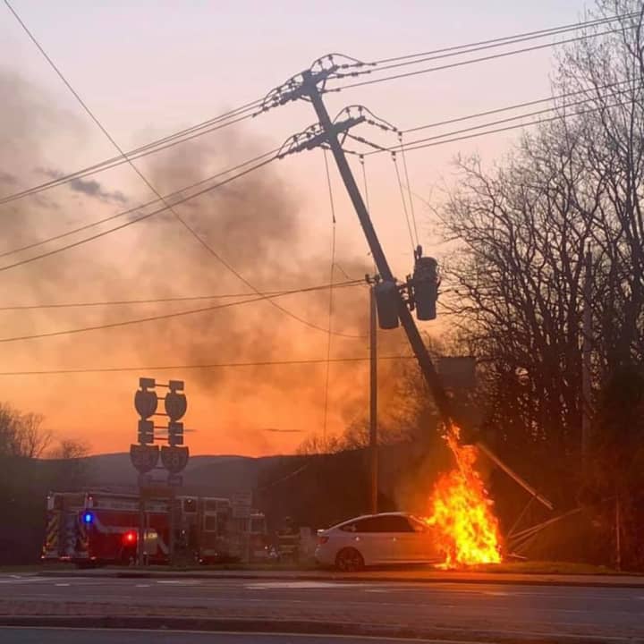 A car slammed into a utility pole in Ramapo sparking a large fire and causing homes in the area to lose power.