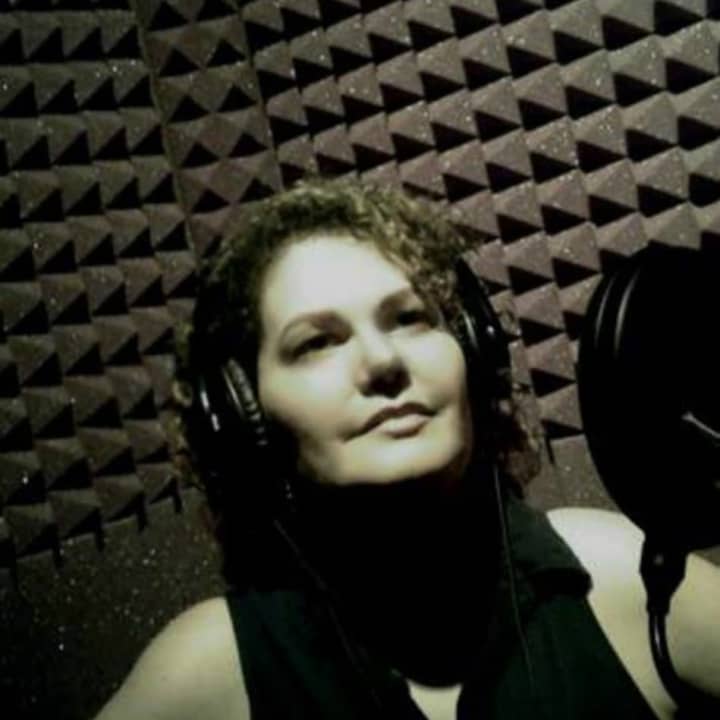 Beacon singer-songwriter Vievanessa in the studio recording her music.