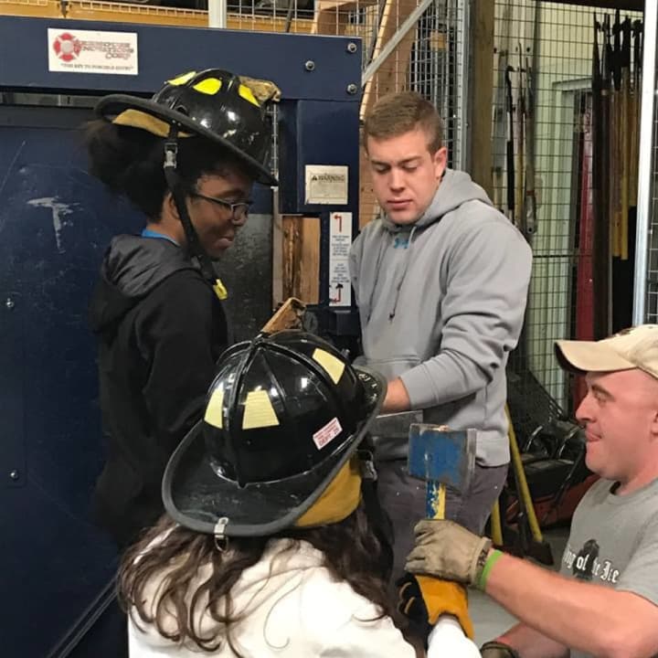 Rockland BOCES students learn forcible entry techniques at the Rockland County Fire Training Center.