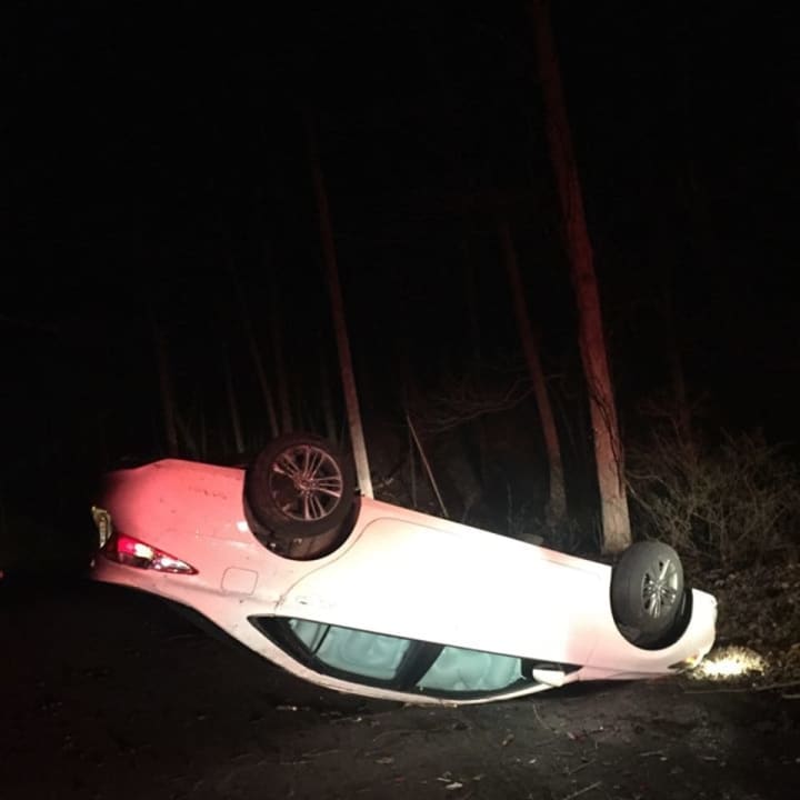 A Connecticut man and his passenger were injured when he lost control of his car, flipping it in Red Hook.