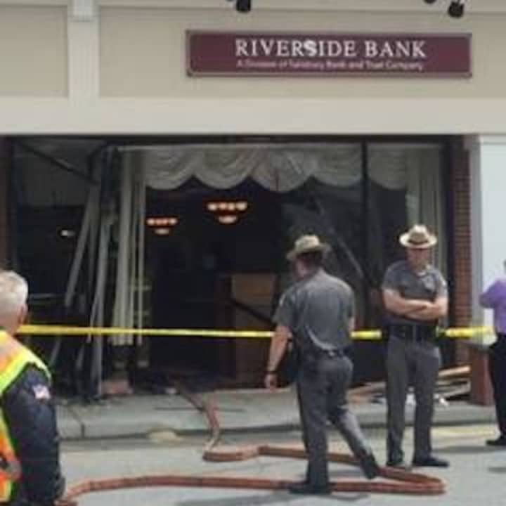 A car plowed through the front of Riverside Bank in the Village of Fishkill causing heavy damage.