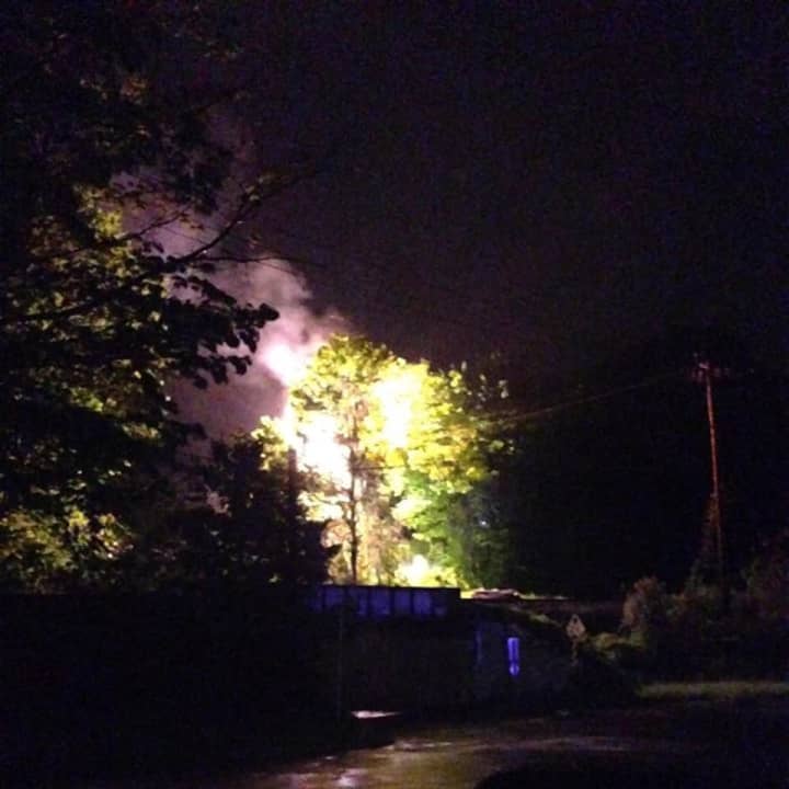 A fire on a utility pole near the &quot;Graffiti Bridge&quot; in Brookfield lights up the sky late Saturday.
