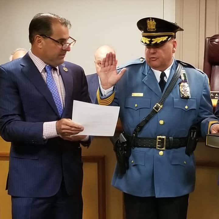 Wood-Ridge Police Chief John Korin is sworn in by Mayor Paul Sarlo.