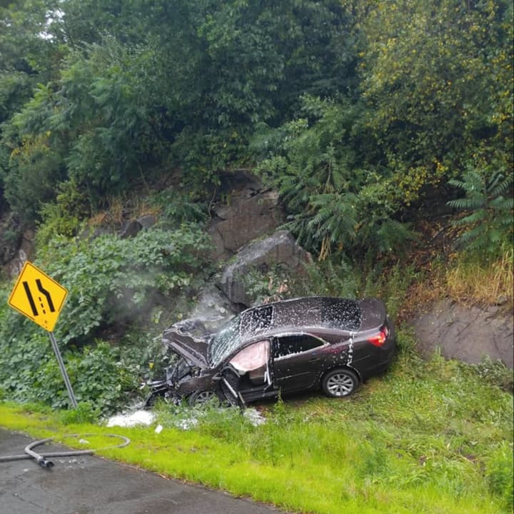 A car slammed into a rock wall on Saturday morning on the southbound side of Route 8 in Shelton.