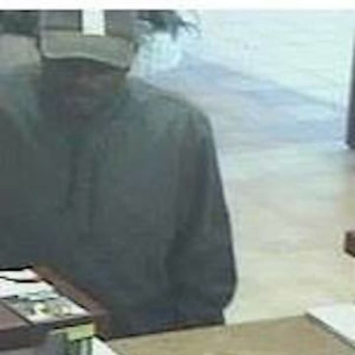 Brookfield police released this photo of the suspect in a Friday bank robbery. The man is 5-foot-10 with a medium build and wearing a black baseball cap with a distinctive stripe.