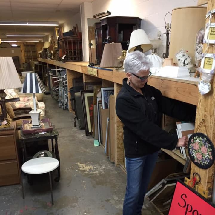 Owner Donna Simone of Yorktown Love in Action looks over the inventory following a burglary.
