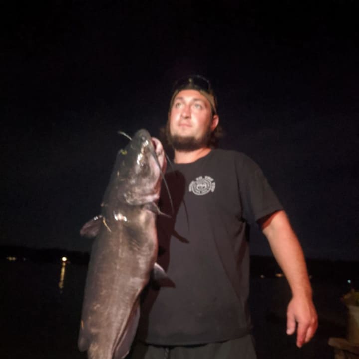 Tomkunas with his large catfish.