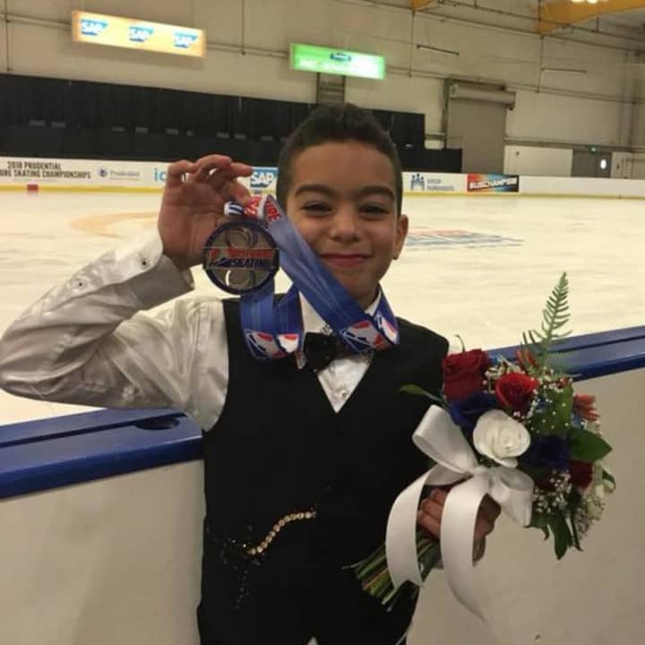 Jacob Sanchez of Montgomery shows off his silver medal at the U.S. Figure Skating Championships. He competed in the Juvenile Boys category.