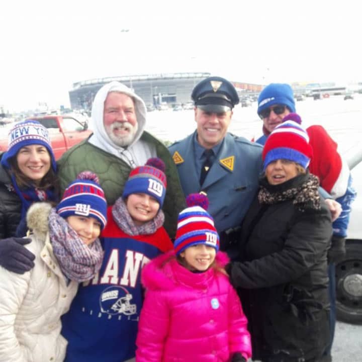 A family waiting to watch the Giants play was thrilled when  New Jersey State Police Detective Dennis Cappello stopped to check on them.