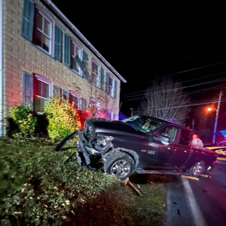 A pickup truck barreled into the front yard of a Lehigh Valley Home after colliding with another vehicle Tuesday evening, authorities said.