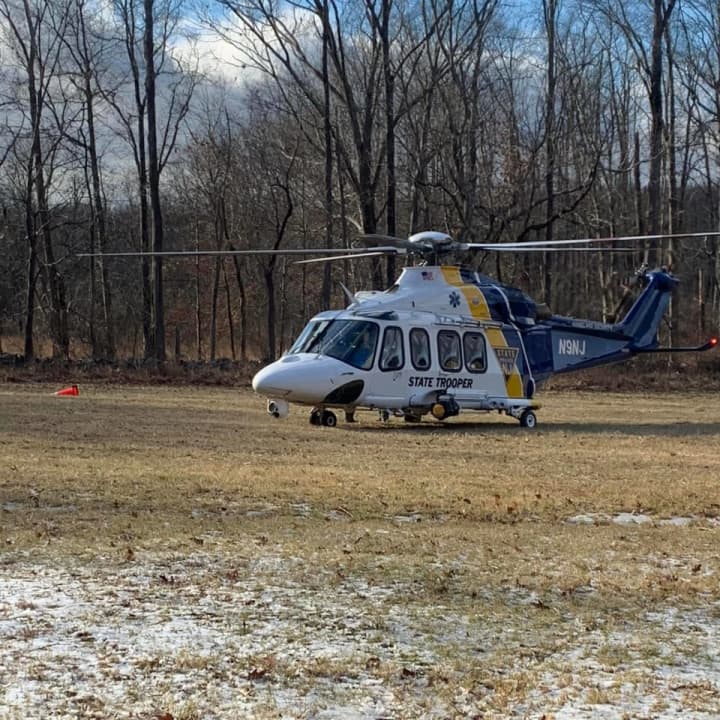 A 58-year-old man was airlifted with serious injuries after getting trapped underneath a tree in Hunterdon County Tuesday afternoon, state police confirmed.