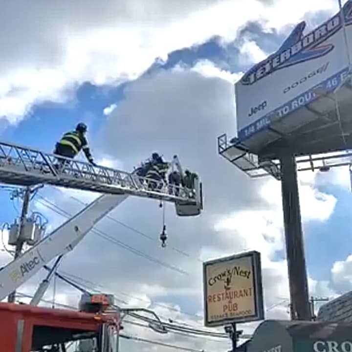 Hackensack firefighters got the trapped workers down safely.