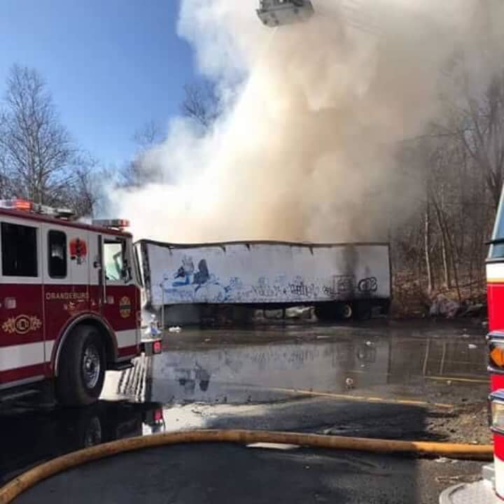 Several tractor-trailers were on fire at a local plastics company.